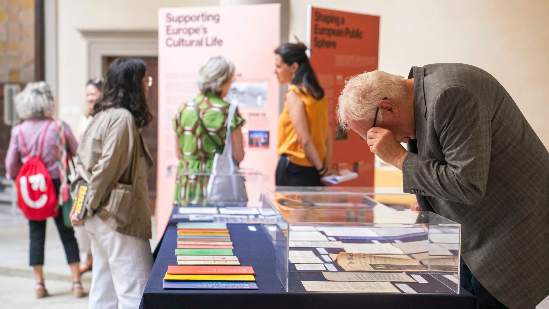 Visitors examine archival display to celebrate opening of European Cultural Foundation documents