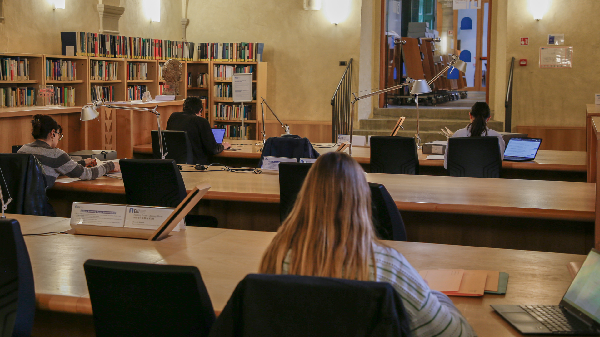 Scholars consulting archival documents in the HAEU reading room.
