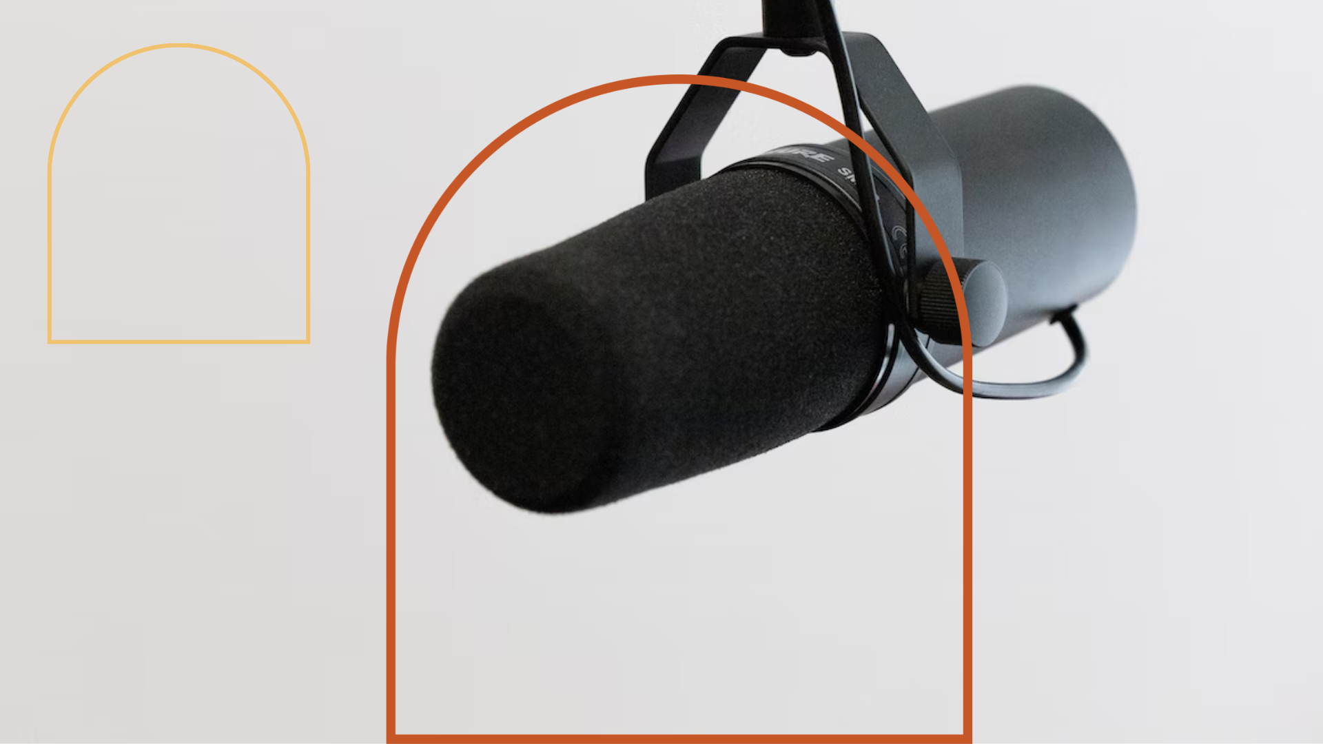 Picture of a black podcasting microphone on white background.