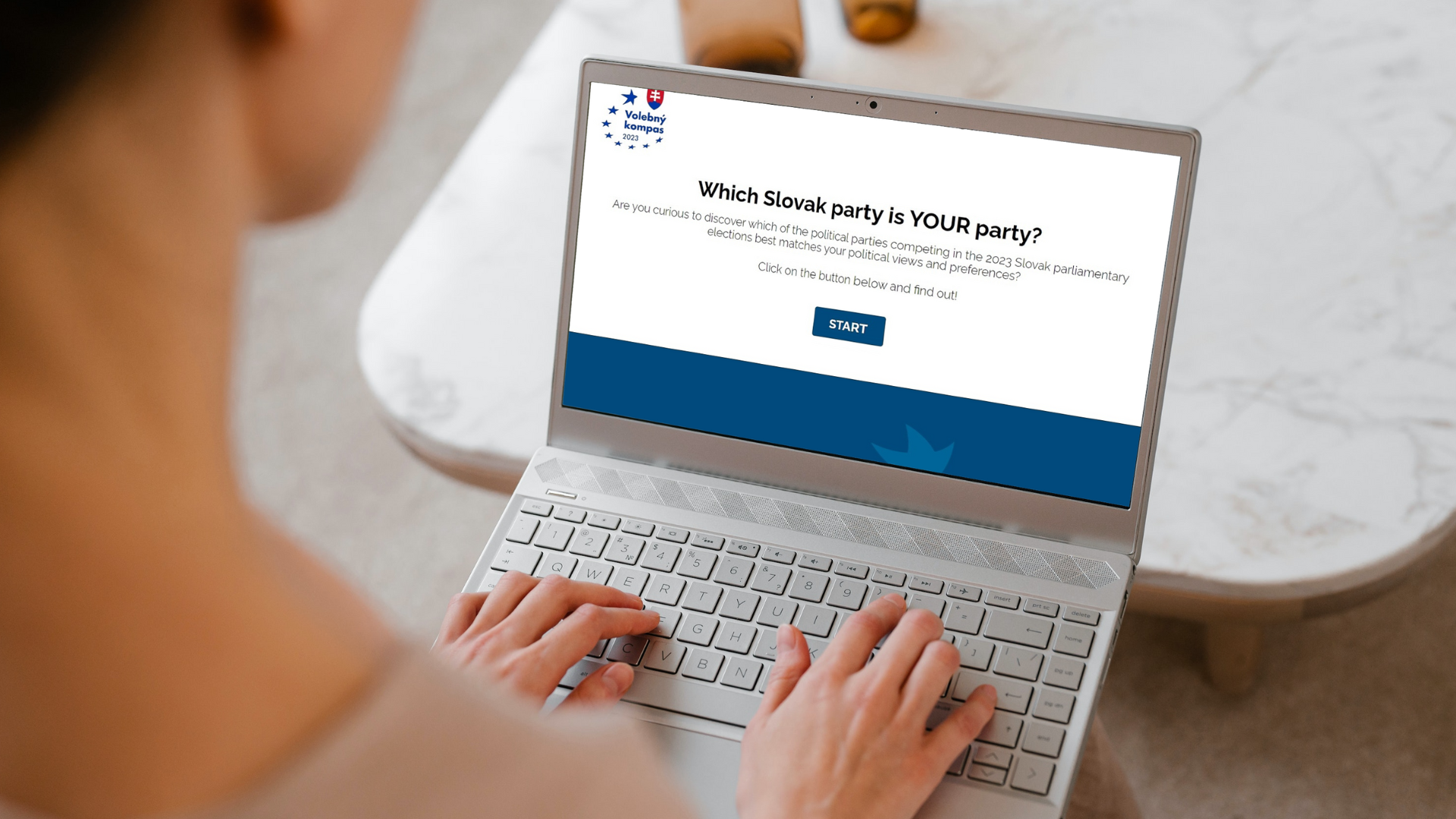Image of a woman using the voting advice application for the Slovak elections on her laptop