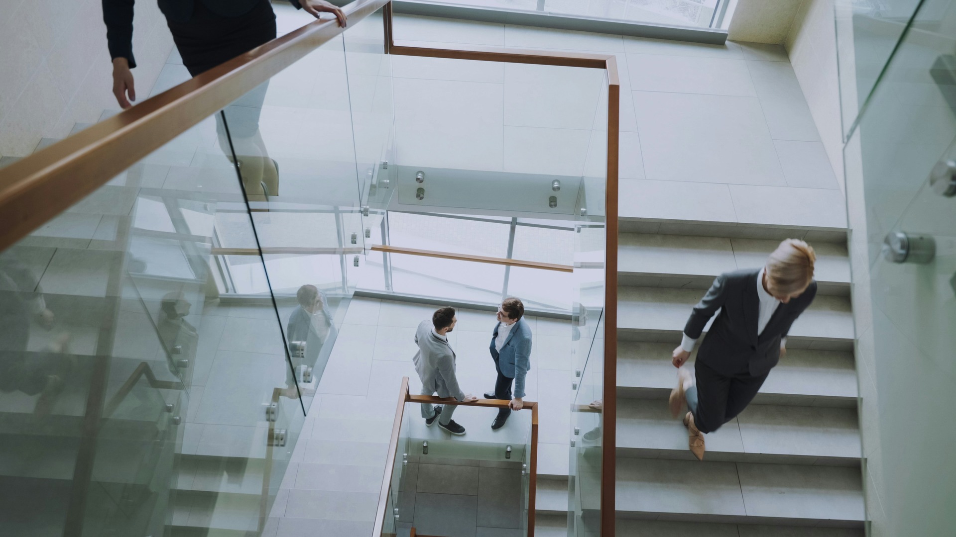 People in a modern office starwell 

