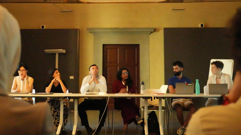 group of people in a meeting conference table sitting down