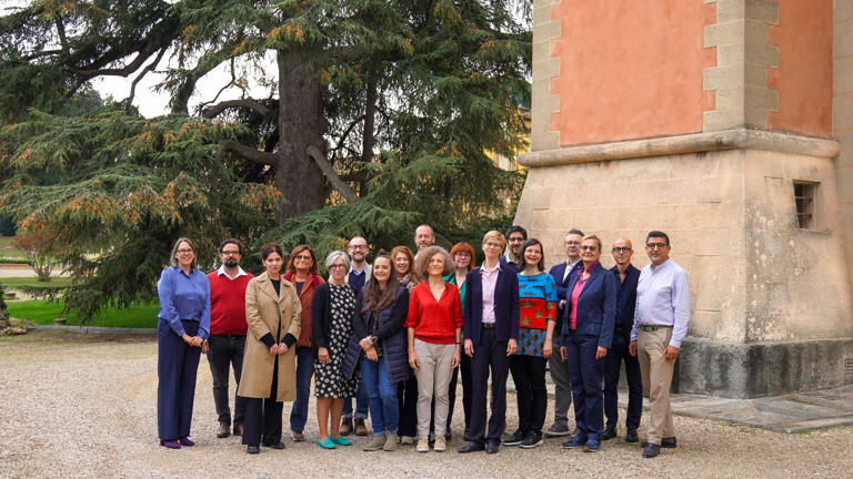 Group picture in garden with members of faculty and staff women and men