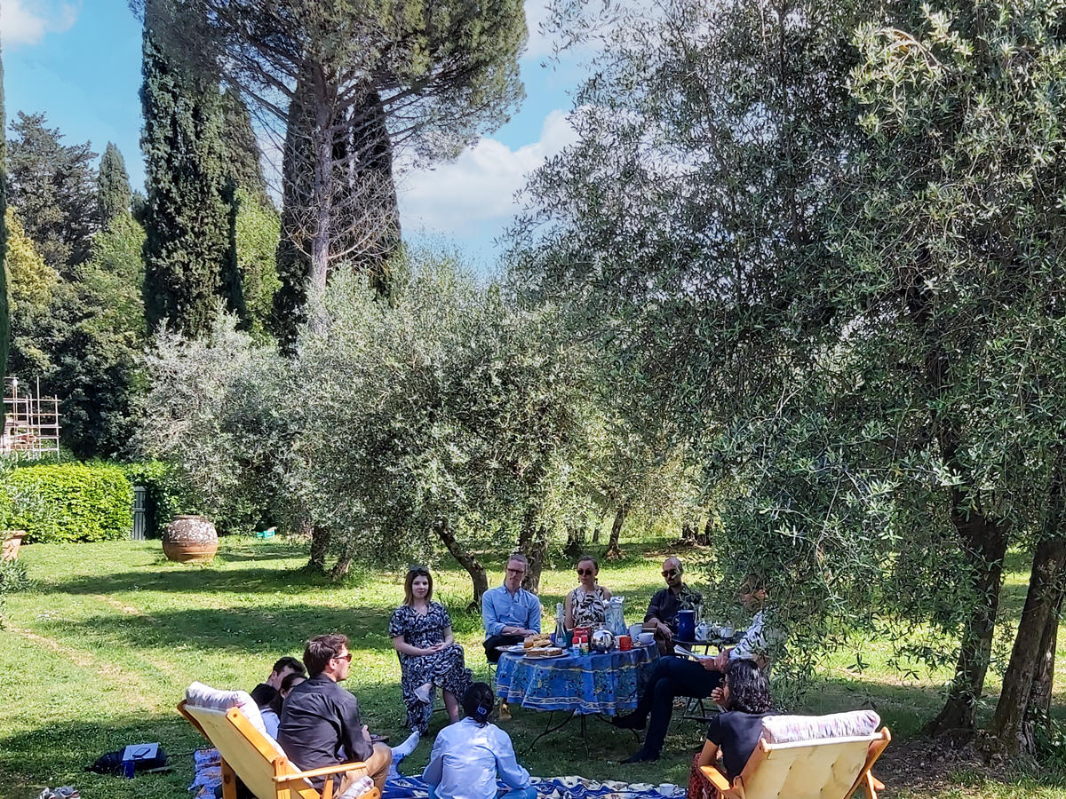 Law-researches-sitting-in-garden-chatting