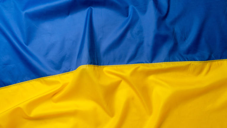 photo of rippled national flag of ukraine