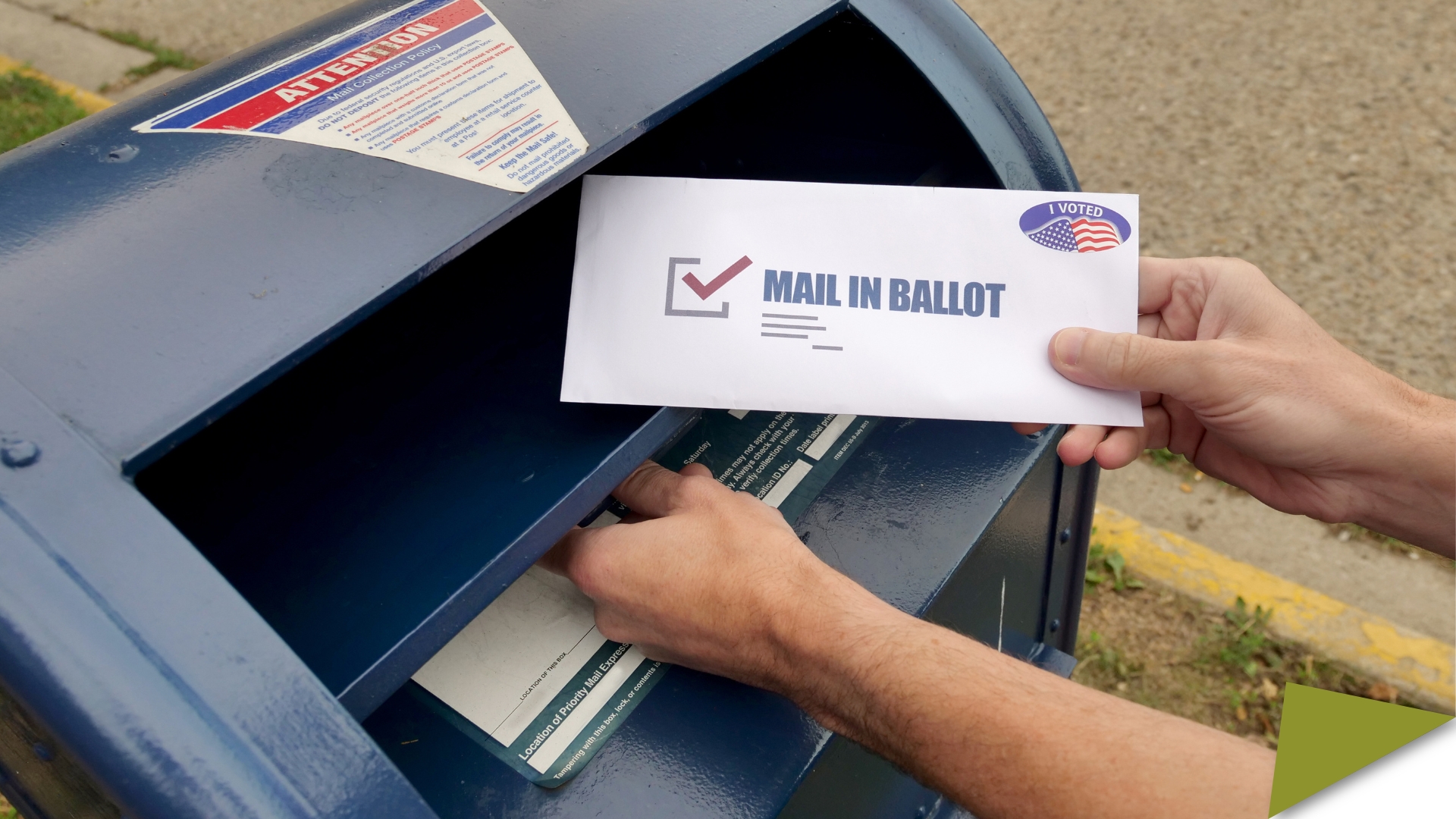 Man's hands posting a mail-in ballot