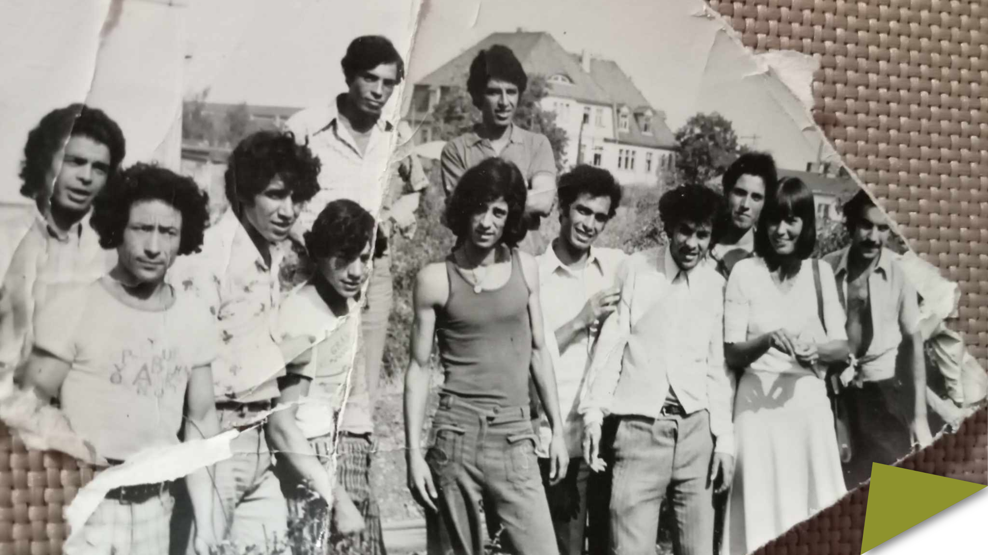 A black-and-white photograph from the 1970s showing a group of young Algerian contract workers standing outdoors in East Germany.