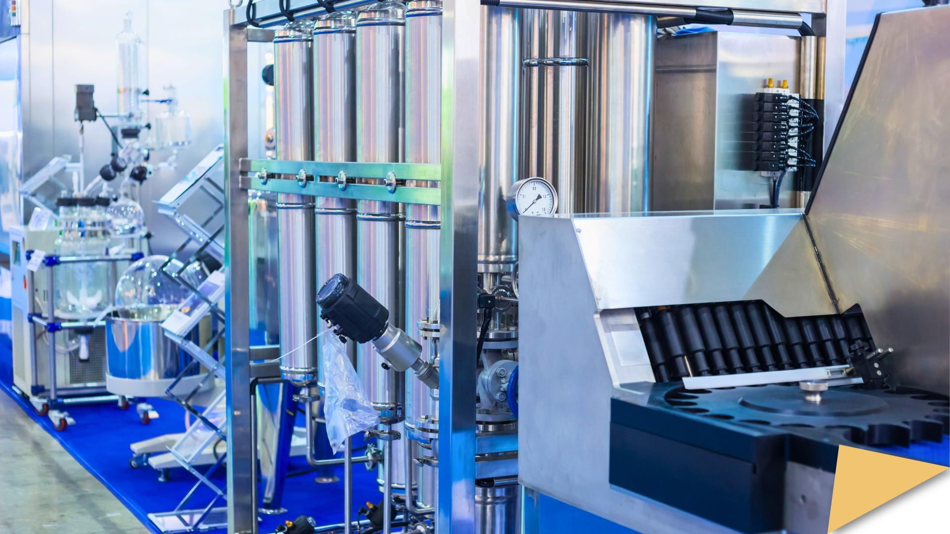 Pharmaceutical manufacturing equipment with steel tanks and gauges.