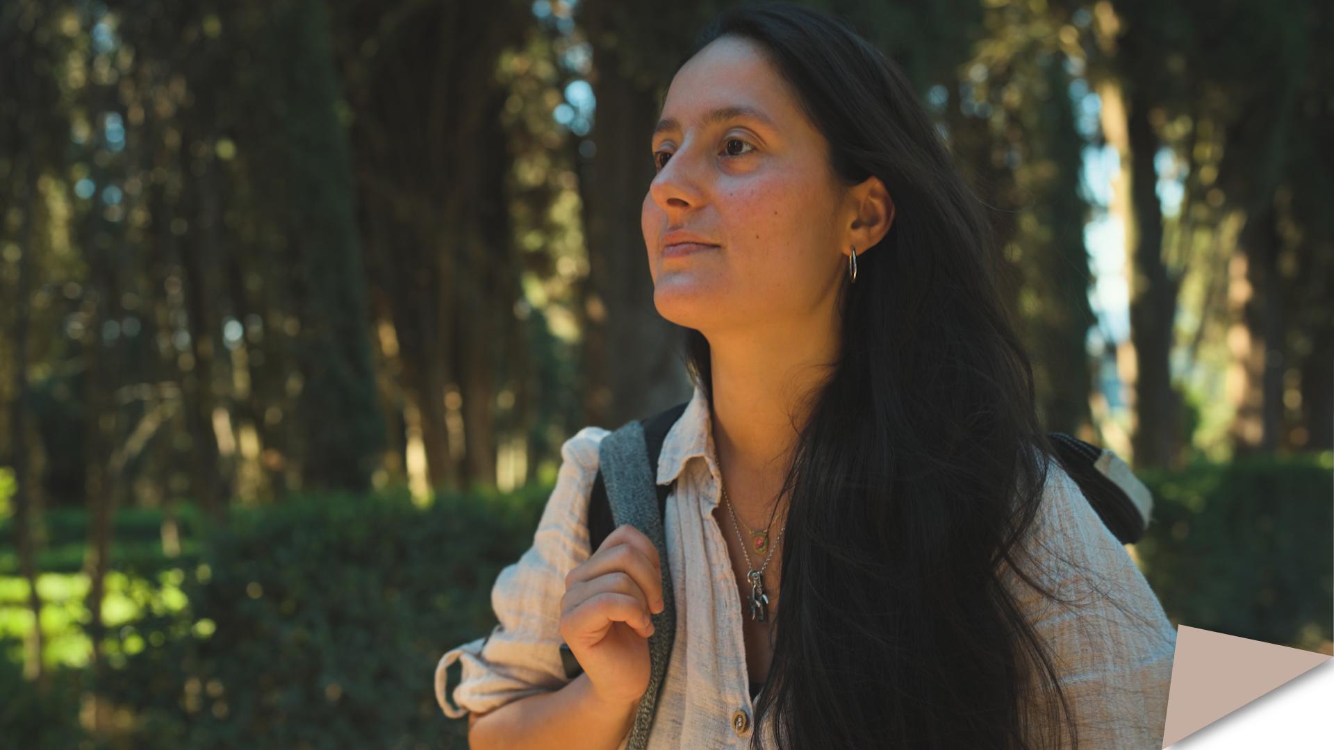 Carolina Paulesu, PhD researcher at the EUI Department of Law, standing outdoors in a garden.