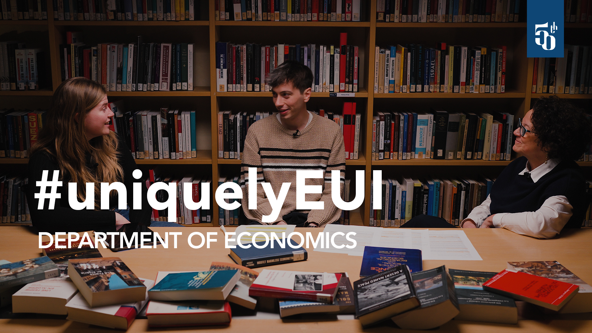 Fabrizia Mealli, Julia Müller, and Michele Castegini sitting together in a library room.