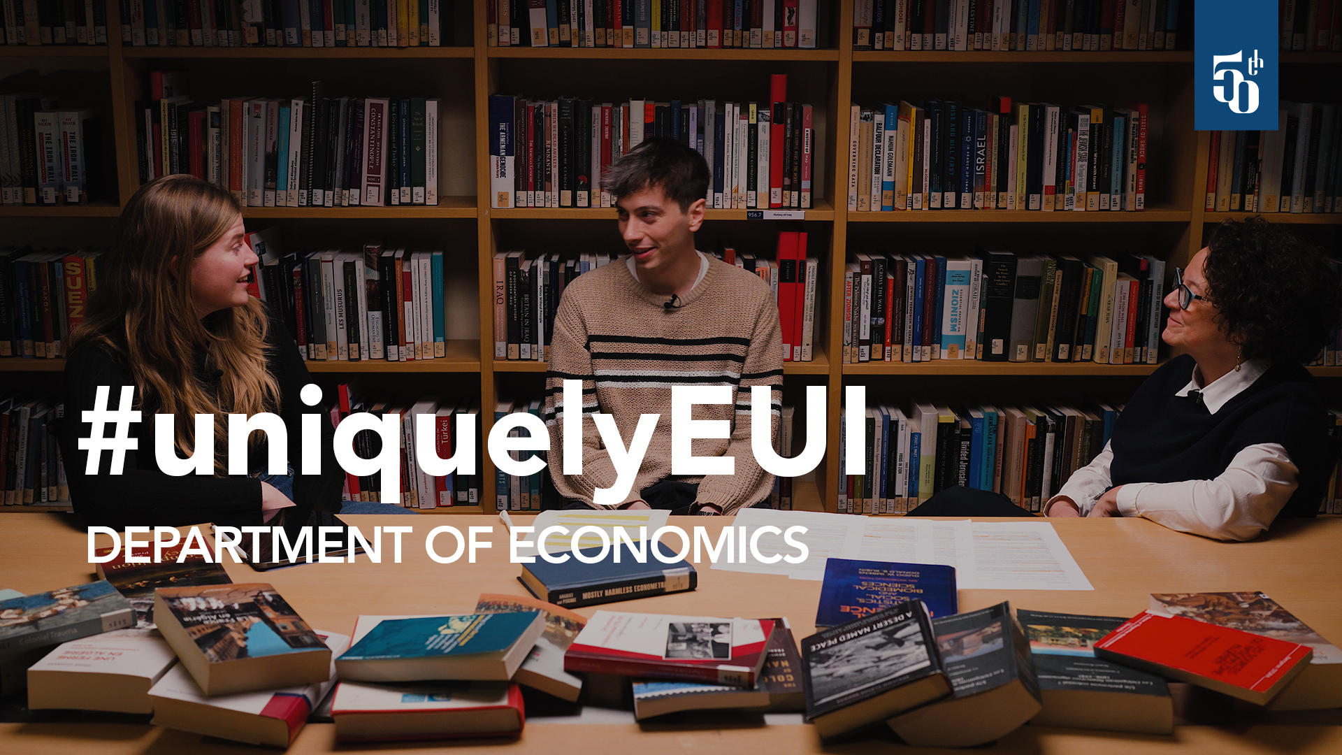 Fabrizia Mealli, Julia Müller, and Michele Castegini sitting together in a library room.