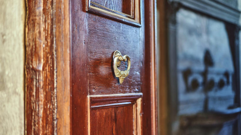 Badia cloister detail of metal handle on open door