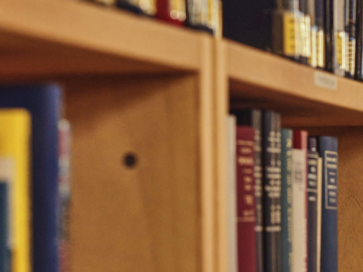 Books in library prospective closeup