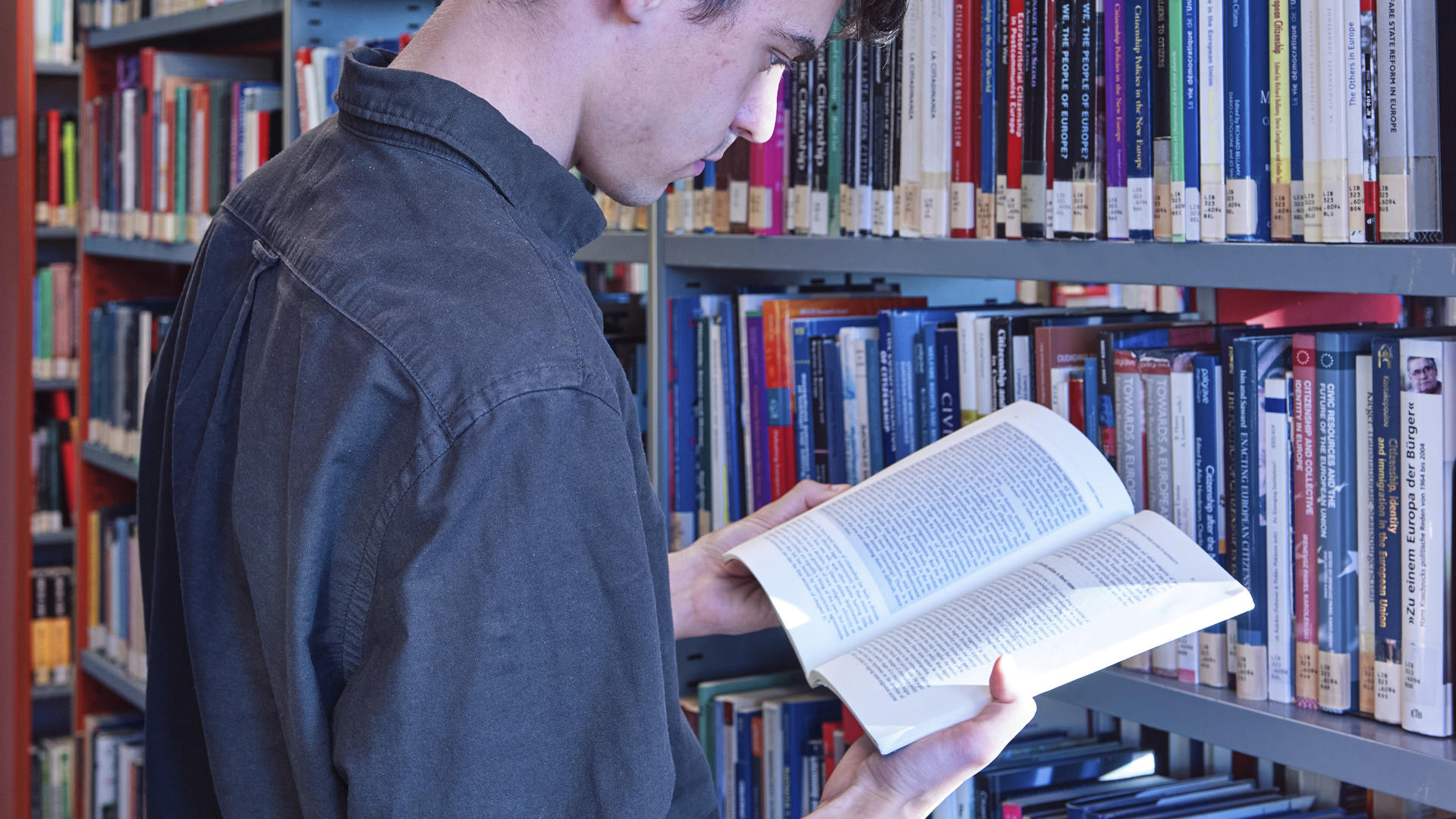 Closeup of student reading in Library