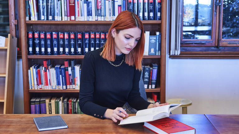 Researcher in library studying
