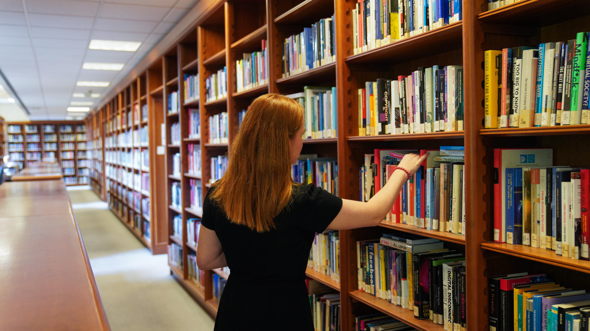 Student browsing books at the Library