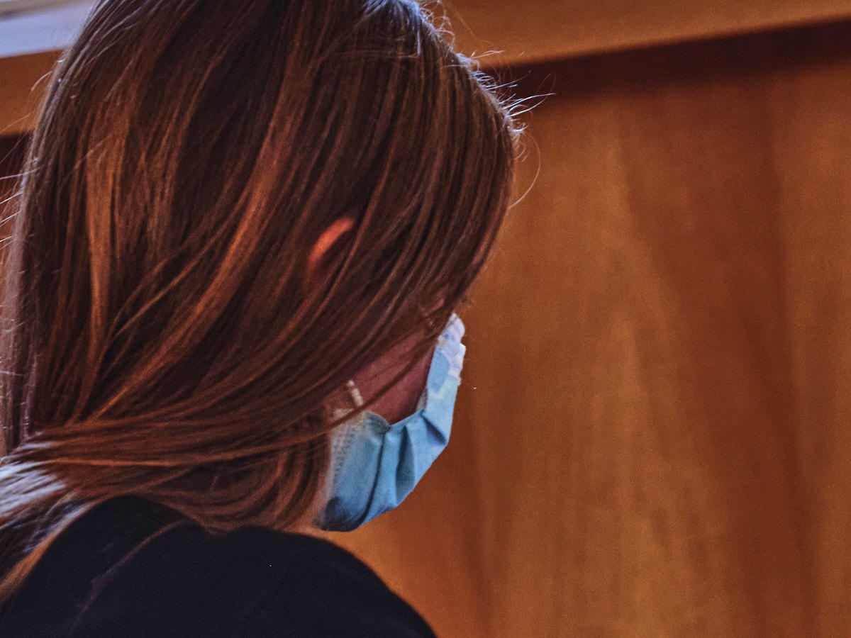 Student working on laptop in study room