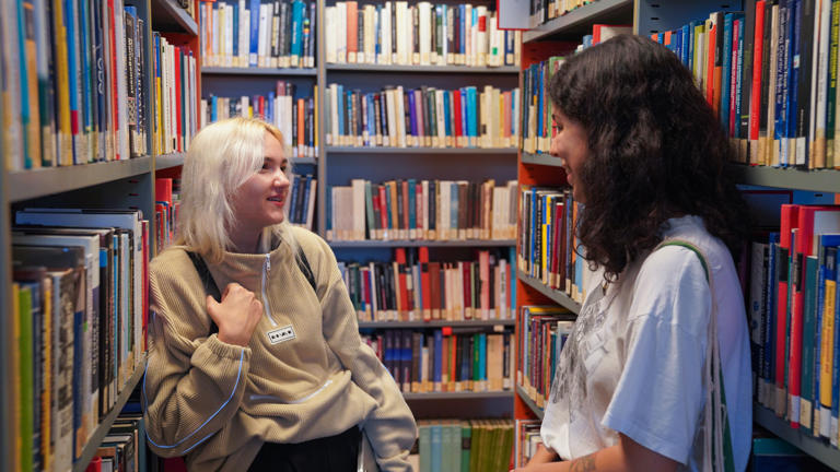 Students talking in the Library